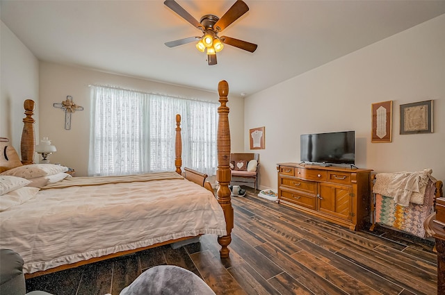 bedroom featuring a ceiling fan and dark wood-type flooring