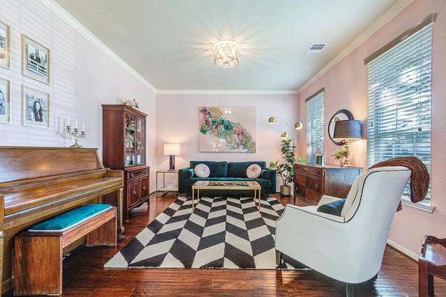 living area featuring crown molding, visible vents, dark wood finished floors, and baseboards