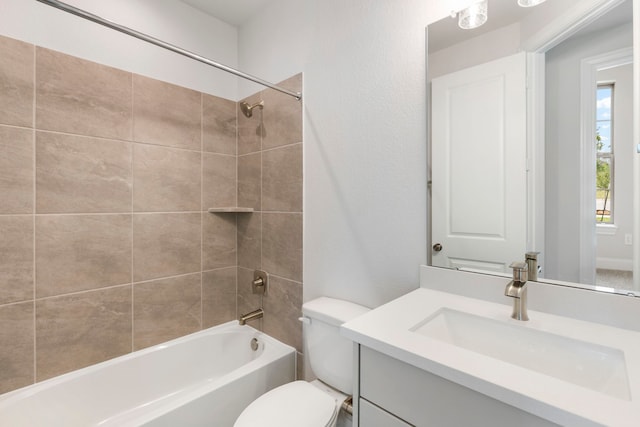 full bathroom featuring tub / shower combination, toilet, and vanity