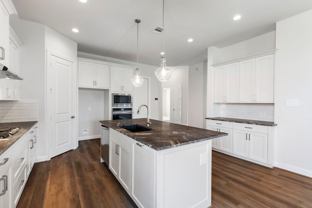 kitchen with visible vents, appliances with stainless steel finishes, dark wood-style flooring, and a sink