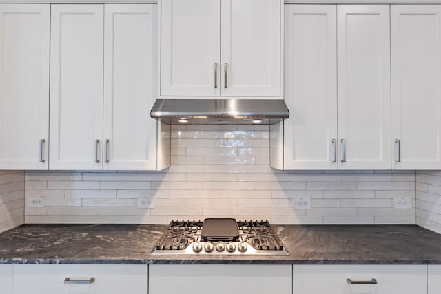 kitchen featuring under cabinet range hood, white cabinets, and stainless steel gas stovetop