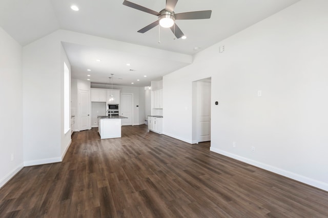 unfurnished living room featuring recessed lighting, baseboards, dark wood-style flooring, and ceiling fan