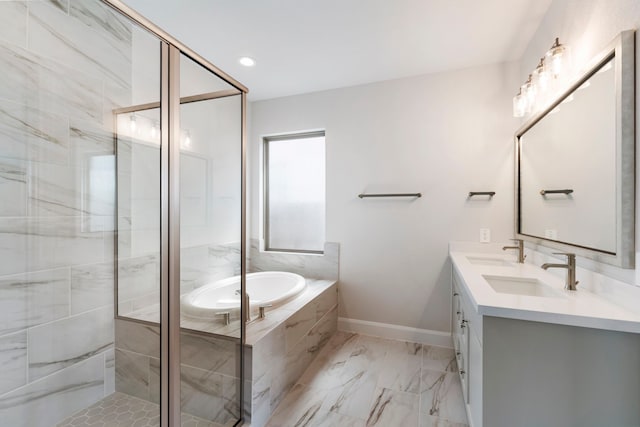 bathroom featuring a shower stall, a garden tub, and a sink