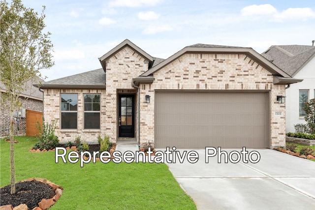 french country home with brick siding, roof with shingles, a front lawn, concrete driveway, and an attached garage