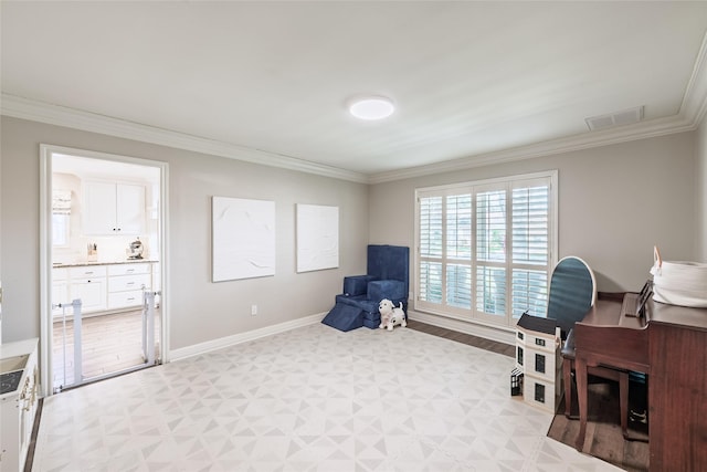 office with ornamental molding, visible vents, and baseboards