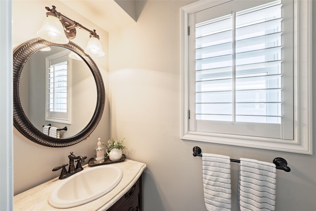 bathroom with plenty of natural light and vanity