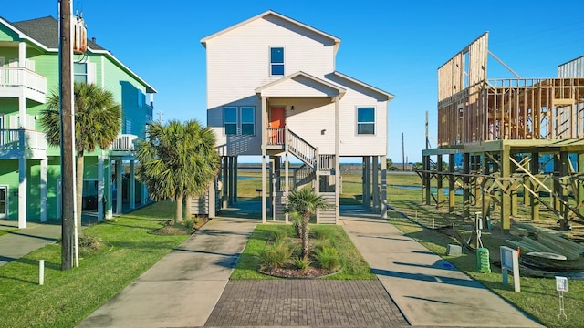 exterior space featuring a carport and a front lawn