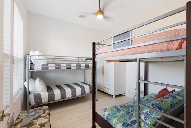 bedroom with wood finished floors and visible vents