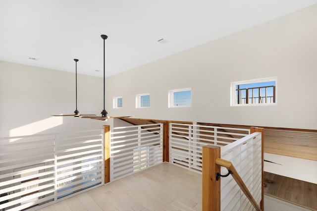 interior space with ceiling fan and wood finished floors