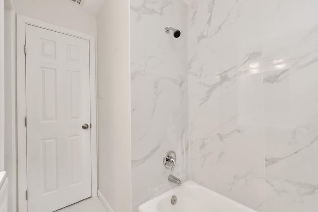 full bathroom with baseboards and shower / bathing tub combination