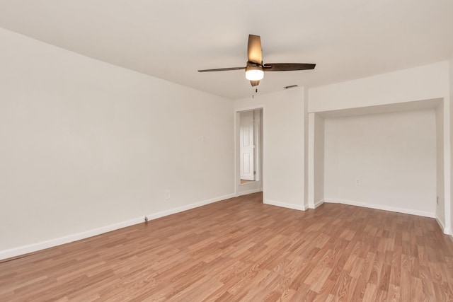 unfurnished bedroom with light wood-style floors, visible vents, ceiling fan, and baseboards