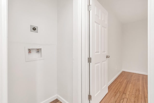 laundry room featuring washer hookup, light wood finished floors, hookup for an electric dryer, laundry area, and baseboards