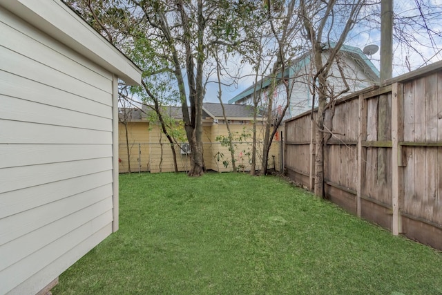 view of yard with a fenced backyard