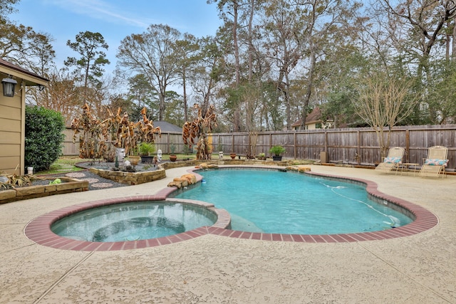 view of pool with a patio area, a fenced backyard, and a pool with connected hot tub