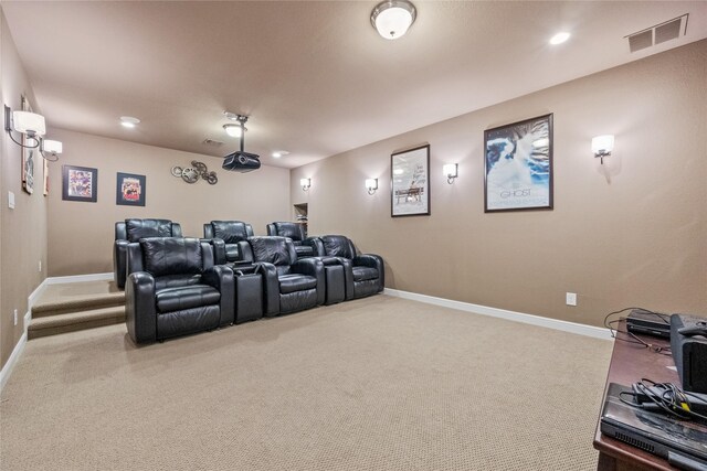 carpeted cinema room with recessed lighting, visible vents, and baseboards