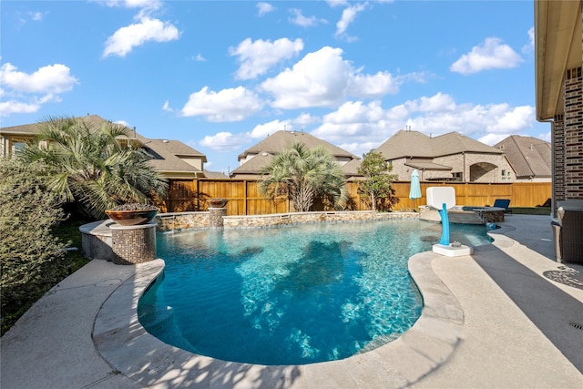 view of pool with a fenced backyard, a jacuzzi, a fenced in pool, and a patio