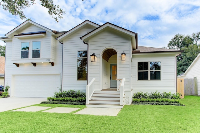 view of front facade with a garage, fence, a front lawn, and concrete driveway