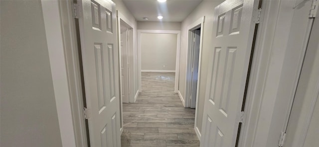 716 Alamo St, Rosenberg, TX 77471 - hall featuring light wood finished floors, baseboards, and recessed lighting