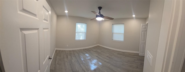 716 Alamo St, Rosenberg, TX 77471 - unfurnished room with dark wood-type flooring, ceiling fan, baseboards, and recessed lighting