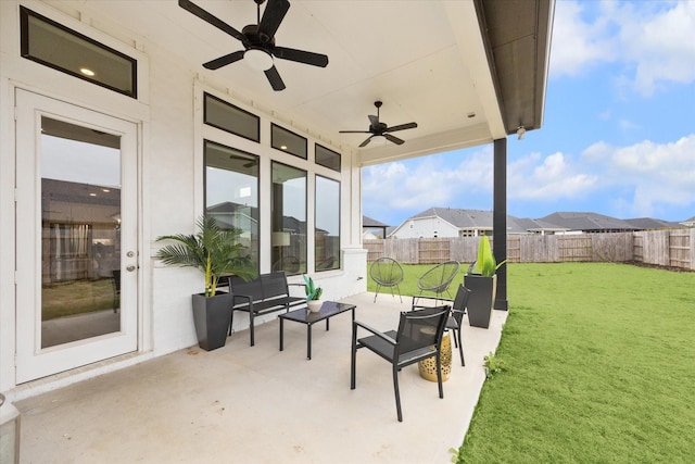 view of patio / terrace featuring a ceiling fan, a fenced backyard, and a residential view