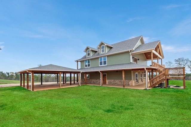 rear view of property featuring a yard, stairs, a patio, and a gazebo