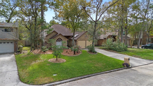 view of front facade featuring a garage, driveway, and a front lawn