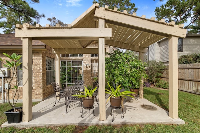 view of patio featuring fence