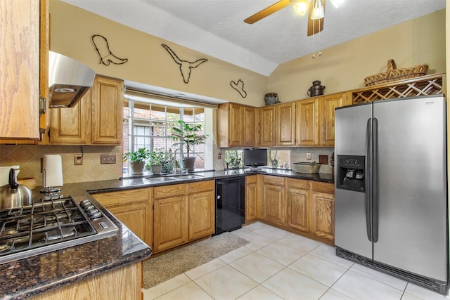 kitchen with range hood, stainless steel appliances, lofted ceiling, decorative backsplash, and a sink