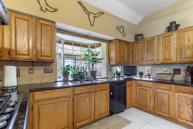 kitchen featuring gas cooktop, a sink, brown cabinets, dishwasher, and tasteful backsplash