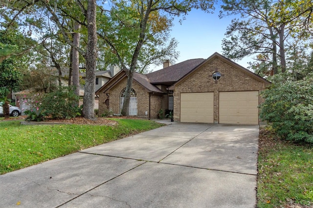 view of front of home featuring brick siding, a chimney, concrete driveway, a garage, and a front lawn