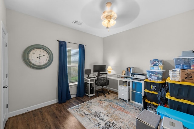 office area featuring baseboards, visible vents, ceiling fan, and wood finished floors