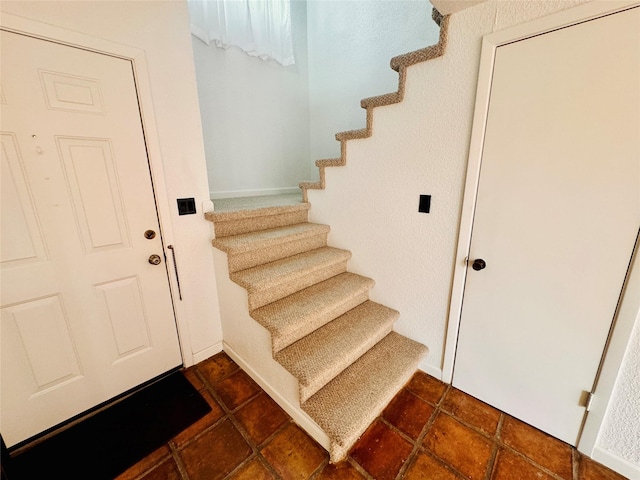 stairway with baseboards