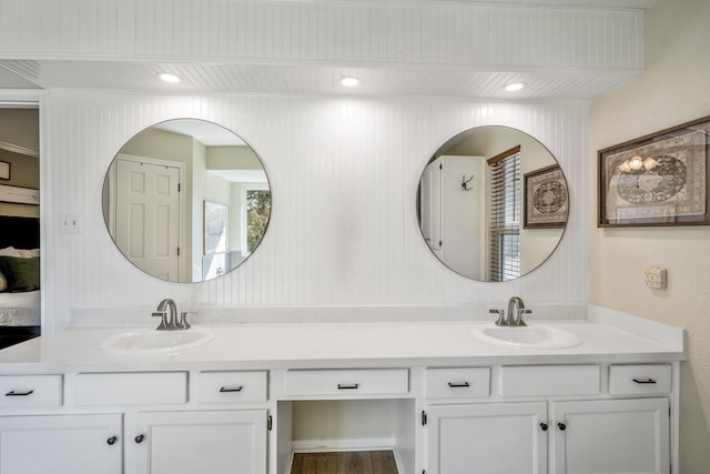 full bath with double vanity and a sink