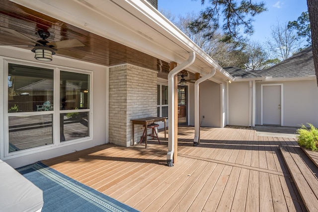 wooden deck featuring a ceiling fan