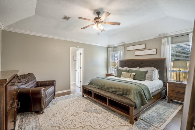 bedroom featuring multiple windows, visible vents, and wood finished floors