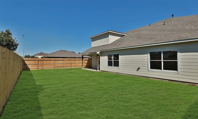 view of yard with a fenced backyard