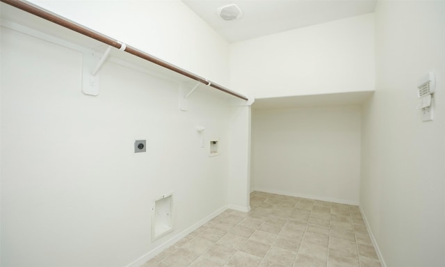 clothes washing area with laundry area, baseboards, gas dryer hookup, hookup for a washing machine, and electric dryer hookup