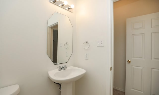 bathroom featuring toilet