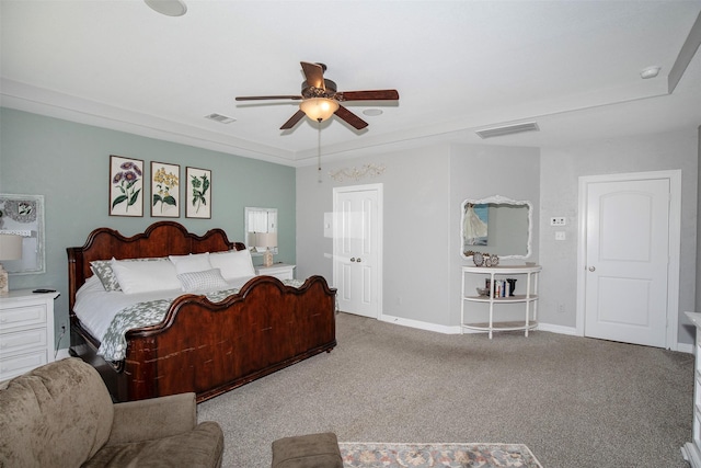 bedroom with carpet floors, visible vents, ceiling fan, and baseboards