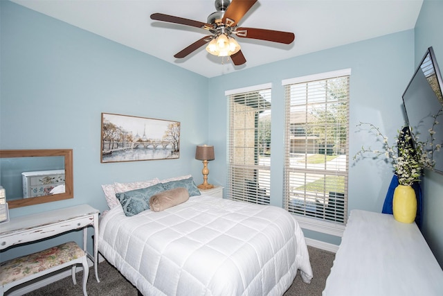 bedroom with carpet flooring, a ceiling fan, and baseboards