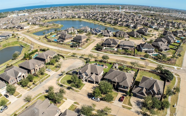 bird's eye view with a residential view and a water view