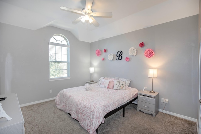 bedroom featuring light carpet, baseboards, and lofted ceiling