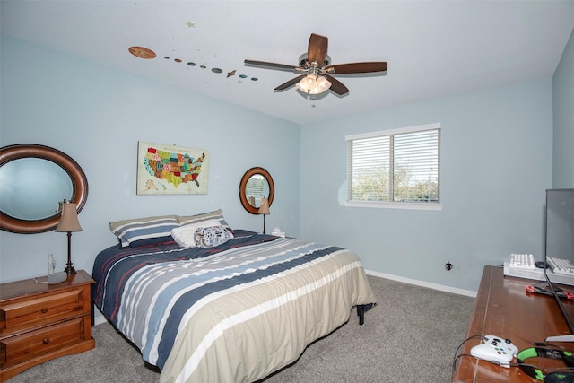 carpeted bedroom with ceiling fan and baseboards