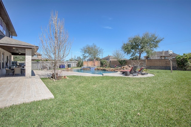 view of yard featuring a fenced in pool, a fenced backyard, and a patio