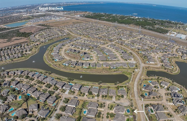 birds eye view of property featuring a water view and a residential view