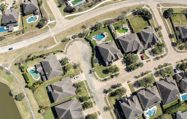 birds eye view of property with a residential view