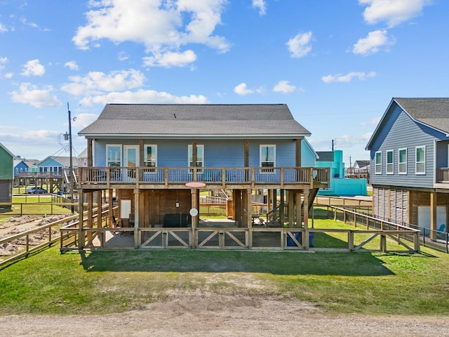 1922 Blue Water Hwy, Surfside Beach, TX 77541 - back of house with an exterior structure, a shingled roof, and a garage