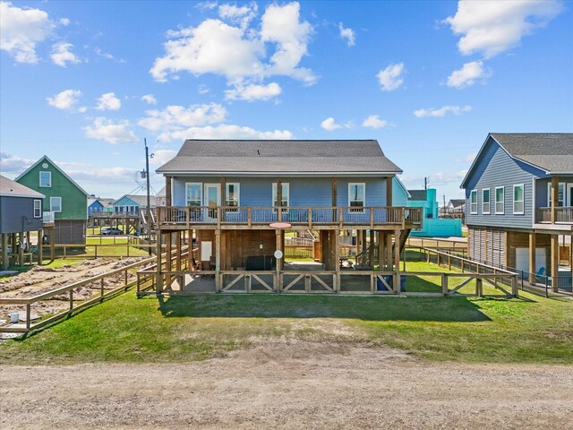 1922 Blue Water Hwy, Surfside Beach, TX 77541 - back of house featuring an exterior structure, roof with shingles, and an attached garage