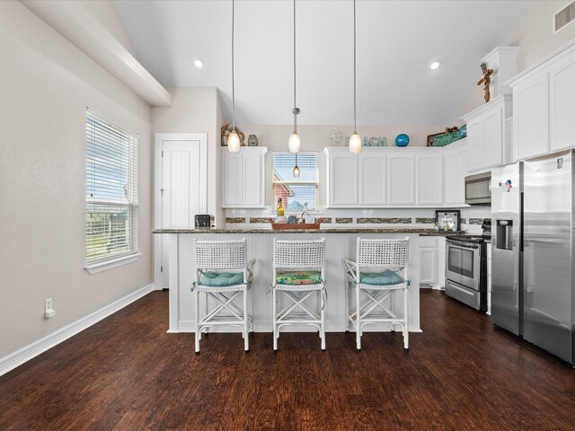 1922 Blue Water Hwy, Surfside Beach, TX 77541 - kitchen with stainless steel appliances, white cabinetry, dark wood-style floors, lofted ceiling, and recessed lighting