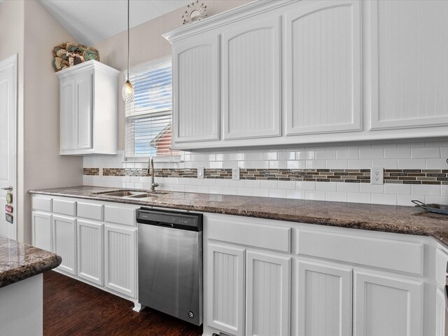 1922 Blue Water Hwy, Surfside Beach, TX 77541 - kitchen featuring stainless steel dishwasher, a sink, white cabinetry, and backsplash